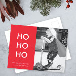 Ho Ho Ho | Red Xmas Photo Fun Modern Minimalist Holiday Postcard<br><div class="desc">Simple, stylish "Ho Ho Ho" photo holiday postcard in bright red with a modern minimalist typography in white which can be easily personalised with your own greeting, family name & year for a trendy festive season! The card shows an example image an adorable happy little boy riding a scooter playing...</div>