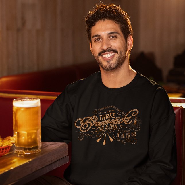 HOGSMEADE™ THE THREE BROOMSTICKS™ Pub & Inn Sweatshirt (Person wearing sweatshirt)