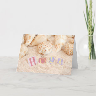 Hola, hello in Spanish on a sandy beach Card