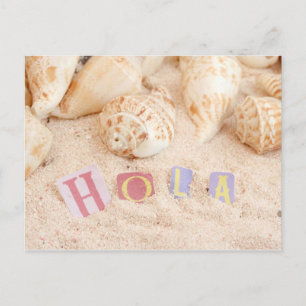 Hola, hello in Spanish on a sandy beach Postcard