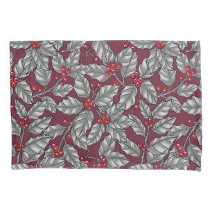 Holly berry, gray leaves on dark red pillowcase