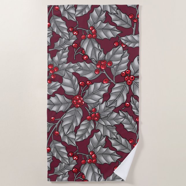 Holly berry, grey leaves on dark red beach towel (Front)