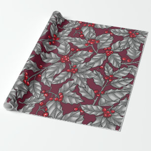 Holly berry, grey leaves on dark red wrapping paper