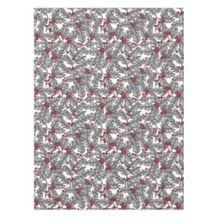 Holly berry, grey leaves on white tablecloth