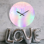 Holographic unicorn glitter drip rainbow monogram large clock<br><div class="desc">A trendy holographic background with unicorn and rainbow pastel colors in pink, purple, rose gold, mint green. Decorated with faux glitter drips in rose gold, pink and purple. Personalize and add a name, written with a modern hand lettered style script with swashes. Purple colored letters. To keep the swashes only...</div>