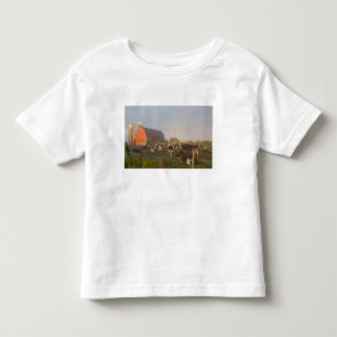 Holstein dairy cows outside a barn at sunrise toddler T-Shirt
