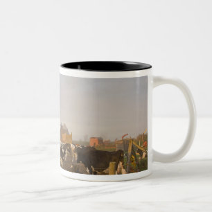 Holstein dairy cows outside a barn at sunrise Two-Tone coffee mug