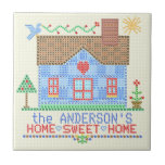 Home Sweet Home Cross Stitch House Personalised Tile<br><div class="desc">This personalised country house design is made to resemble a vintage cross stitch embroidery sampler. It shows a blue house made of "x"s with a bird, the sun and plenty of hearts and flowers in the same style. The background is beige with a slight check pattern to look like embroidery...</div>