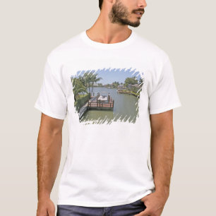 Homes and docks on canal Marco Island Florida T-Shirt