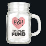Honeymoon fund mason jar for newlyweds<br><div class="desc">Honeymoon fund mason jar for newlyweds. Collect money and funds in this jar glass jar. Handy finance pot for saving coins and paper bills. Also great for saving money for expensive trips, vacations, cars, gadgets and more. Personalise with your own name initials of bride and groom. Pink heart logo with...</div>