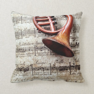 horn ornament on music throw pillow