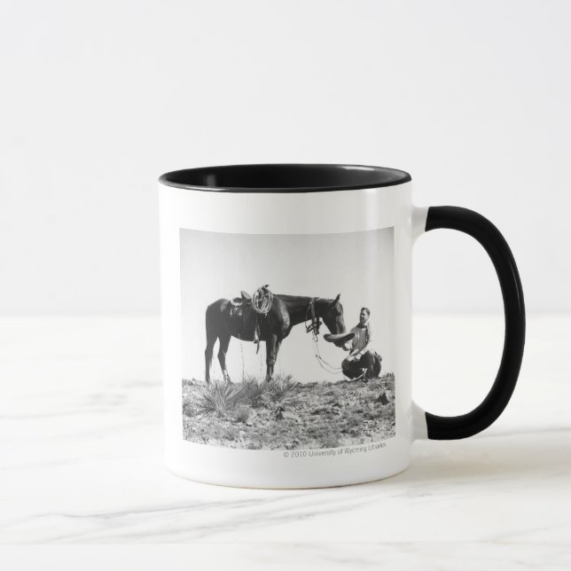 Horse eating from a cowboy's hat. mug (Right)