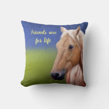 Horse in a luscious green field in a summer day