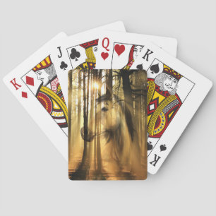 Horse in sunshine woods playing cards
