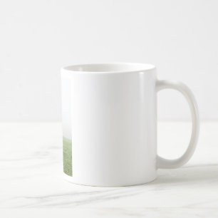 Horse in the mist on a meadow coffee mug