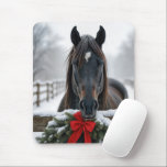 Horse With a Christmas Wreath Mouse Mat<br><div class="desc">A horse stands behind a wooden fence adorned with a festive wreath and red bow,  surrounded by a snowy winter landscape</div>