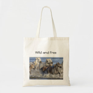 Horses galloping in the water tote bag