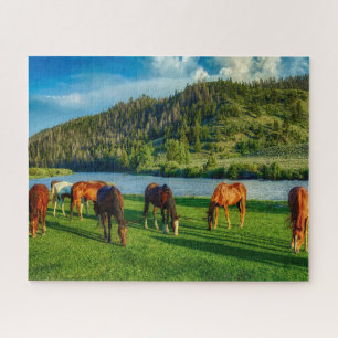 Horses Grazing Near A River And Mountain  Jigsaw Puzzle