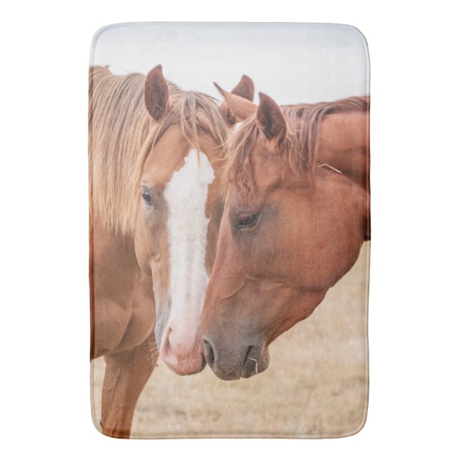 Horses nuzzling in a pasture bath mat (Front Vertical)