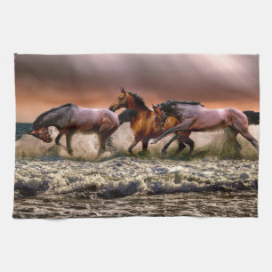 Horses Running in Ocean Surf at Sunset Tea Towel