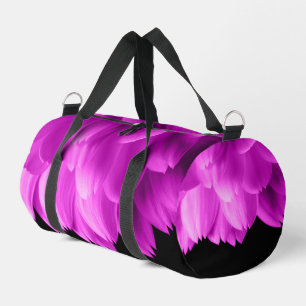 Hot pink flower petals on black duffle bag