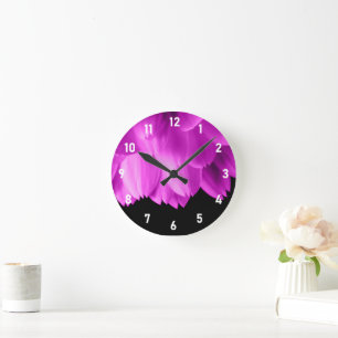 Hot pink flower petals on black round clock
