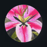 Hot pink lily Tenerife pop art watercolor flower Round Clock<br><div class="desc">with original design from watercolour painting by artist Sacha Grossel of hot pink lily flower in close up,  pop art macro style. This botanical inspired floral design is very bright and colourful with intense pink petals and green background.</div>