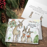 Humble and Kind Donkey Family Christmas Card<br><div class="desc">Celebrate the spirit of Christmas with a touch of whimsy and a whole lot of heart! This delightful greeting card showcases a charming family of cartoon donkeys enjoying a snowy winter scene, complete with festive mistletoe and a Christmas tree. The front of the card carries the endearing and memorable message:...</div>