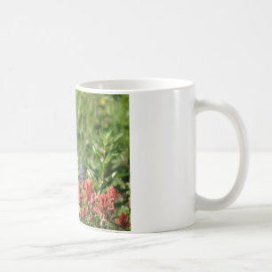 Hummingbird in wild flowers coffee mug