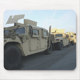 Humvees sit on the pier at Morehead City Mouse Mat