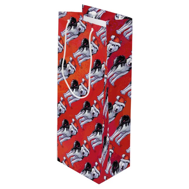 Husky in Santa Hat On Red Wine Gift Bag (Front Angled)