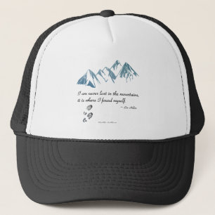 I am never lost in the mountains, it is where... trucker hat