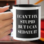 I Can't Fix Stupid Text on Coffee Mug<br><div class="desc">I Can't Fix Stupid But I Can Sedate It is printed on both sides of this black and white mug,  perfect for a paramedic,  doctor or nurse. Choose your mug style,  handle colour,  inside colour and change the background colour to anything.</div>