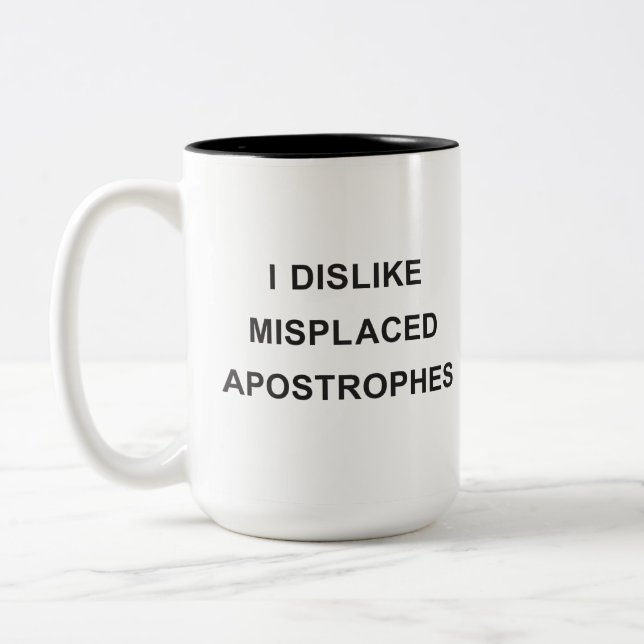I Dislike Misplaced Apostrophes Two-Tone Coffee Mug (Left)