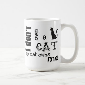 I don't own a cat My cat owns Me Cute mug