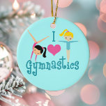 I Love Gymnastics Ceramic Tree Decoration<br><div class="desc">I Love Gymnastics. A pretty gymnastics girl gift with adorable teal text in between two cute tumbling little girls and a beautiful pink heart. A cute gymnast present for a kids or women's gymnastic coach. A brunette in a handstand and a blonde girl with arms extended.</div>