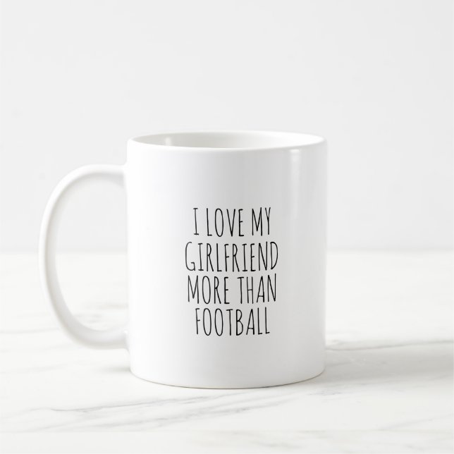 I LOVE MY GIRLFRIEND MORE THAN FOOTBALL  COFFEE MUG (Left)
