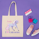 I Love Unicorns Pretty Personalised Unicorn Tote Bag<br><div class="desc">A cute unicorn gift for someone who loves pretty pink and purple unicorns. Beautiful fantasy creatures are my favourite thing. Unicorn image used on this item are licensed and © Graphics Factory.com</div>