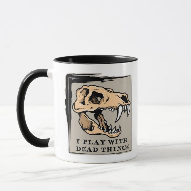 "I Play With Dead Things" Paleontology Fossil Mug (Left)