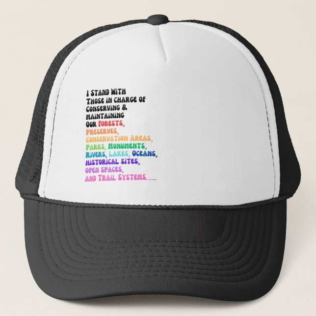 I Stand With Those In Charge Of Protecting Our... Trucker Hat (Front)