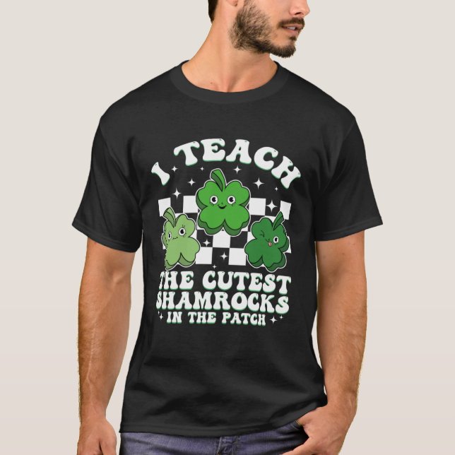 I Teach The Cutest Shamrocks Groovy Teacher St Pat T-Shirt (Front)