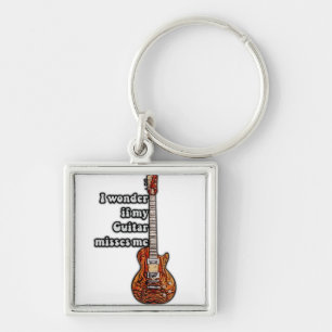 I wonder if my guitar misses me. vintage colours key ring