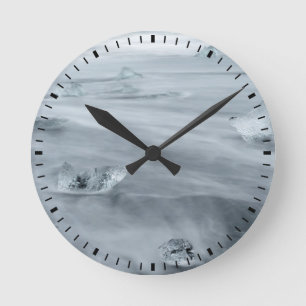 Ice and water on a beach, iceland round clock