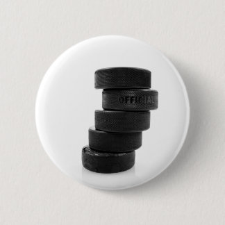 Ice hockey pucks... button