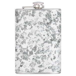 Ice melting on the window hip flask