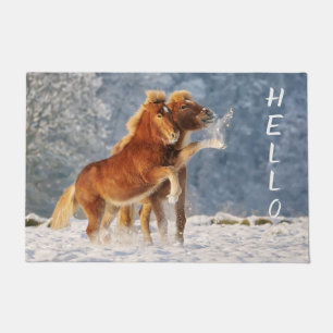 Icelandic horses foal funny playing in snow - doormat