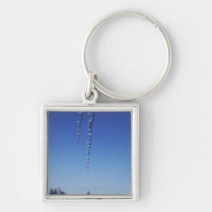 Icicles and snow-covered mountains key ring