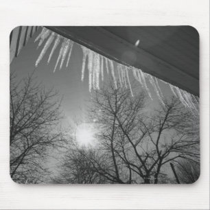 Icicles on roof and sun mouse mat