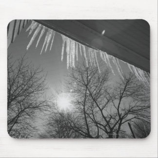 Icicles on roof and sun mouse mat