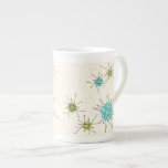 Iconic Atomic Starbursts Bone China Mug<br><div class="desc">This Iconic Atomic Starbursts Bone China Mug pattern features iconic atomic starbursts. That’s right! The old school, cream coloured background with gold speckles is the perfect backdrop for the vibrant turquoise, soothing celery, and kitschy pear green coloured circles. The spots of colour are sporadically placed in various sizes with overlaying...</div>